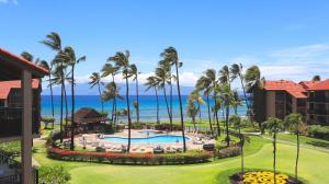 an aerial view of a resort with a pool and palm trees at Maui Westside Presents: Papakea J401 Top floor Ocean Views in Lahaina
