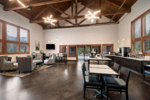 a large room with tables and chairs and a bar at Best Western Mt. Hood Inn in Government Camp