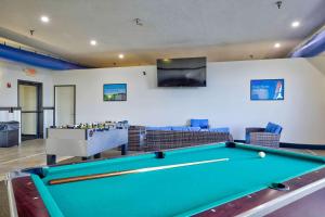 a living room with a pool table and a tv at Motel 6-Percival, IA in Percival