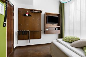 TV a/nebo společenská místnost v ubytování Best Western Hotel Akersberga