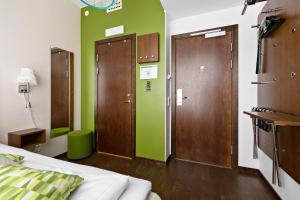 Postel nebo postele na pokoji v ubytování Best Western Hotel Akersberga
