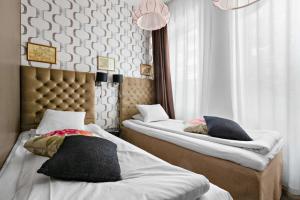 Postel nebo postele na pokoji v ubytování Best Western Hotel Akersberga
