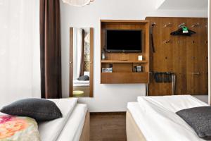 Postel nebo postele na pokoji v ubytování Best Western Hotel Akersberga