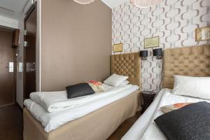 Postel nebo postele na pokoji v ubytování Best Western Hotel Akersberga