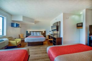 a hotel room with two beds and a desk at Motel 6-Percival, IA in Percival +34 photos