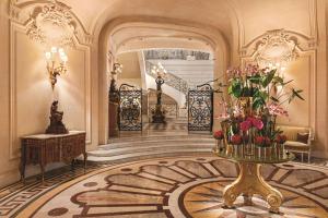 a lobby with a table with flowers on it at Shangri-La Paris in Paris +37 photos
