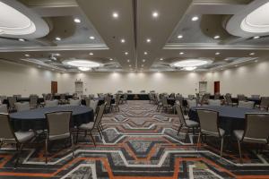 a large room with tables and chairs in it at Drury Plaza Hotel Nashville Franklin in Franklin