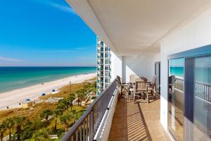 a balcony with a view of the beach and the ocean at Breakers East 604 in Destin