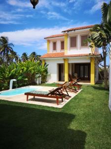 a villa with a pool and a house at Morada Patacho in Pôrto de Pedras