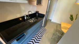 Kuchyň nebo kuchyňský kout v ubytování Novíssimo apartamento no Centro de Foz - perto de tudo + 220 fotografií