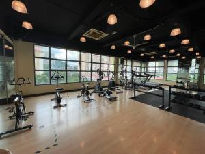 a gym with several treadmills and exercise bikes at Dalamanda 3Pax Sunway Velocity Balcony CItyView in Kuala Lumpur