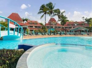 a large swimming pool in front of a resort at Ocean dream in Sainte-Anne