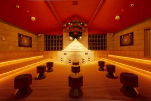 a room with a stage with lights in it at Spa World HOTEL&RESORT in Osaka