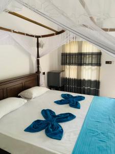 Postel nebo postele na pokoji v ubytování Ramesh Guesthouse