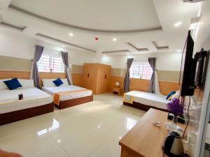 Postel nebo postele na pokoji v ubytování SixPearl Hotel