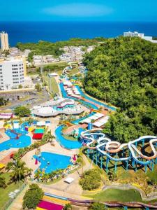 una vista aérea de un parque acuático con toboganes en Summer all year! Oceanfront with Pool A/C, en Aguadilla
