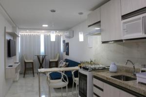 Η κουζίνα ή μικρή κουζίνα στο Residencial Makambira, Aconchegante e completo.