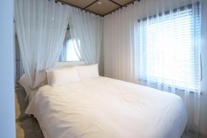 Postel nebo postele na pokoji v ubytování EN Hotel Shibuya
