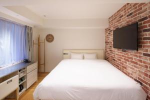 TV a/nebo společenská místnost v ubytování EN Hotel Shibuya