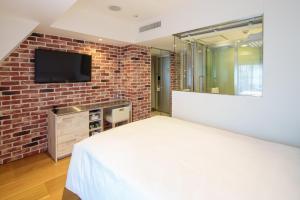 TV a/nebo společenská místnost v ubytování EN Hotel Shibuya