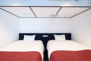 Postel nebo postele na pokoji v ubytování EN Hotel Shibuya