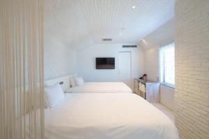 Postel nebo postele na pokoji v ubytování EN Hotel Shibuya