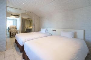 Postel nebo postele na pokoji v ubytování EN Hotel Shibuya