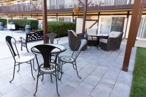 a group of chairs and tables on a patio at Pea Soup Andersen's Inn in Buellton