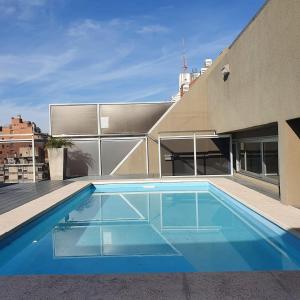 a swimming pool on the roof of a building at LOCADOR Nueva Cordoba 10A in Cordoba