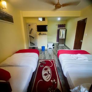 Letto o letti in una camera di Hotel Elite Pokhara