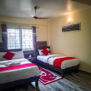 Letto o letti in una camera di Hotel Elite Pokhara