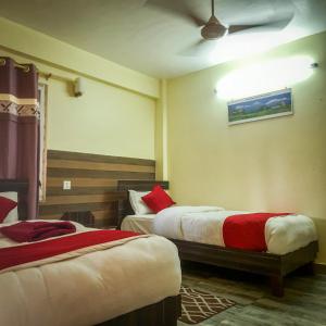 Letto o letti in una camera di Hotel Elite Pokhara