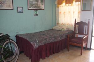 En eller flere senge i et værelse på Green Sea Inn San Luis