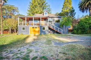 a house with a large driveway in front of it at Luxury River Home - Pets Stay Free in Monte Rio