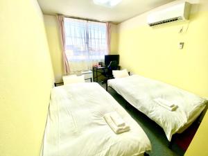 Krevet ili kreveti u jedinici u okviru objekta HendaKara Hotel