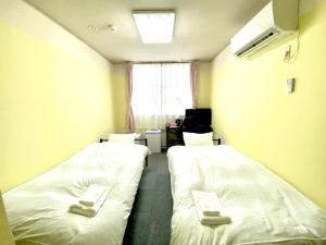 Krevet ili kreveti u jedinici u okviru objekta HendaKara Hotel