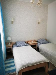 Llit o llits en una habitació de Piejūras apartamenti STEAMER