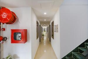a hallway with a red tv on the wall at Via The Prasiddh in Agra +19 photos