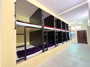 a row of bunk beds in a dorm room at The Darsya in Varanasi