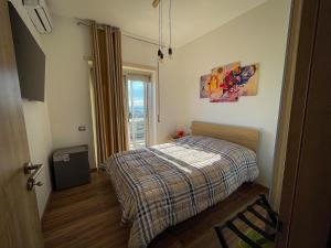 Postel nebo postele na pokoji v ubytování Napoli Emozionale - Vespucci