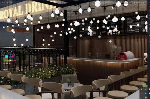 コンダオにあるSixPearl Hotelのテーブル、椅子、照明付きのレストラン