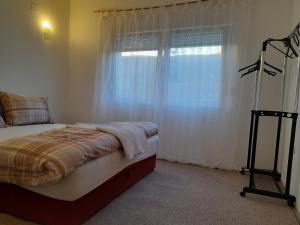 Postel nebo postele na pokoji v ubytování Apartman Avdić