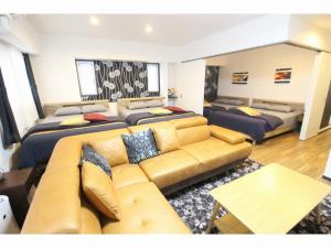 a large living room with a couch at Condominium Felicita Naha in Naha