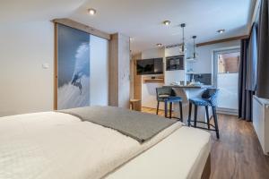 Postel nebo postele na pokoji v ubytování Garni Ötztal ROOMS & APARTS