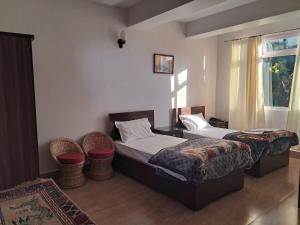 A bed or beds in a room at The Sherpa's Abode