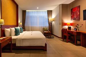 Voodi või voodid majutusasutuse Indra Hotel toas