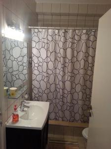 a bathroom with a sink and a toilet at Gorgeous Pool View Apartment - Tala Bay Resort, Aqaba in Aqaba