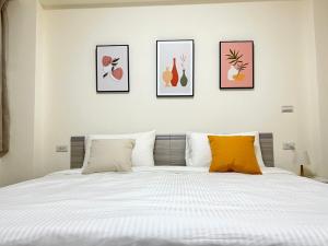 Postel nebo postele na pokoji v ubytování Hourlight Homestay