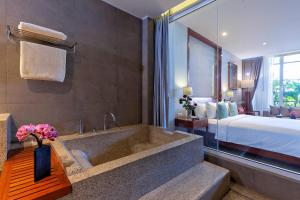 Voodi või voodid majutusasutuse Indra Hotel toas