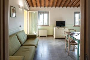 a living room with a couch and a table at Incanto Toscano in Larciano